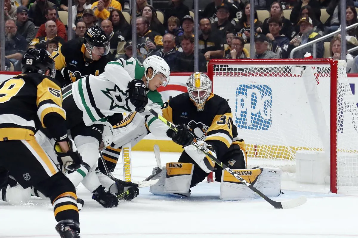 Dallas Stars left wing Jason Robertson (21) shoots and scores a goal against Pittsburgh Penguins goaltender Alex Nedeljkovic (39) during the second period at PPG Paints Arena.
