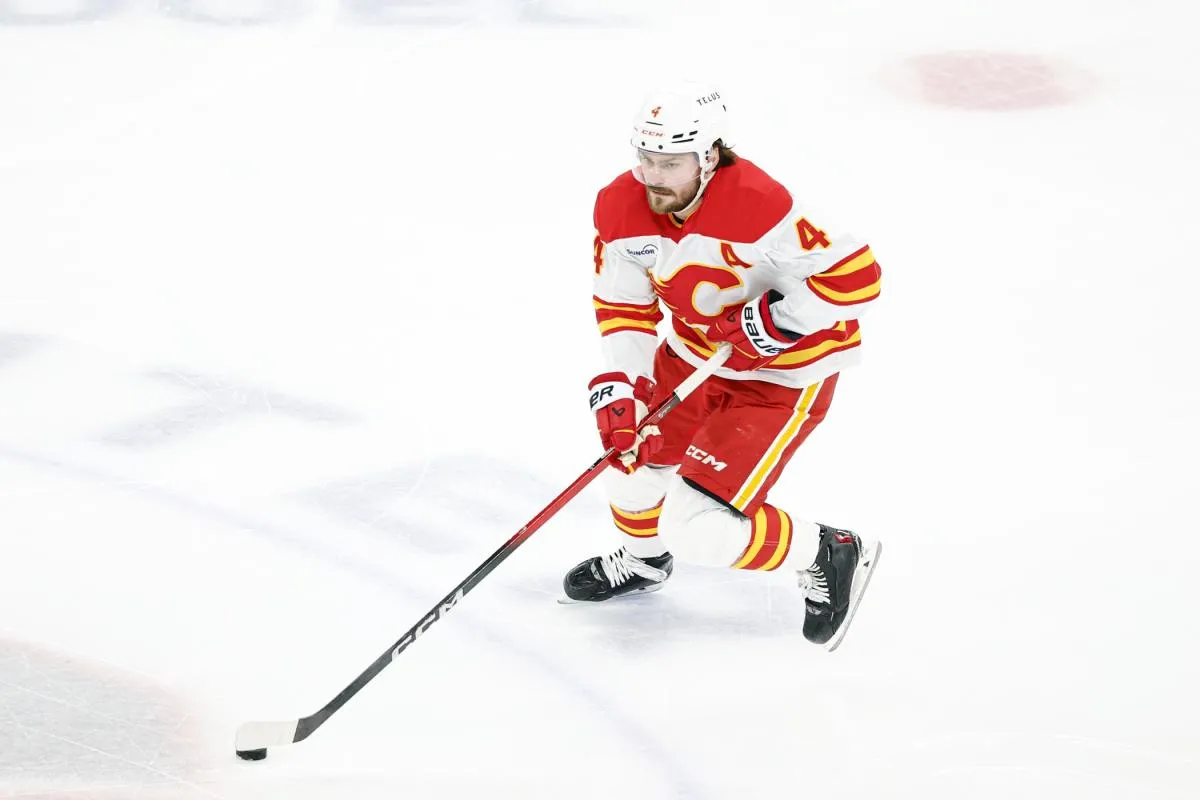 Calgary Flames defenseman Rasmus Andersson (4) controls the puck against the Chicago Blackhawks during the second period at United Center