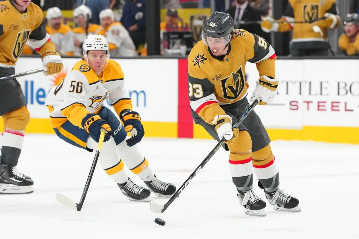 Vegas Golden Knights right wing Mitch Marner (93) controls the puck ahead of Nashville Predators left wing Erik Haula (56) during the first period at T-Mobile Arena.