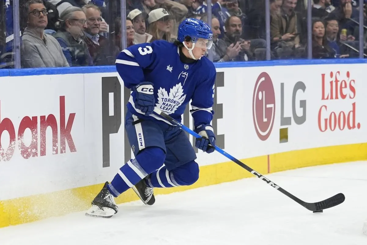 Toronto Maple Leafs defenseman Henry Thrun (3) controls the puck against the San Jose Sharks during the second period at Scotiabank Arena.