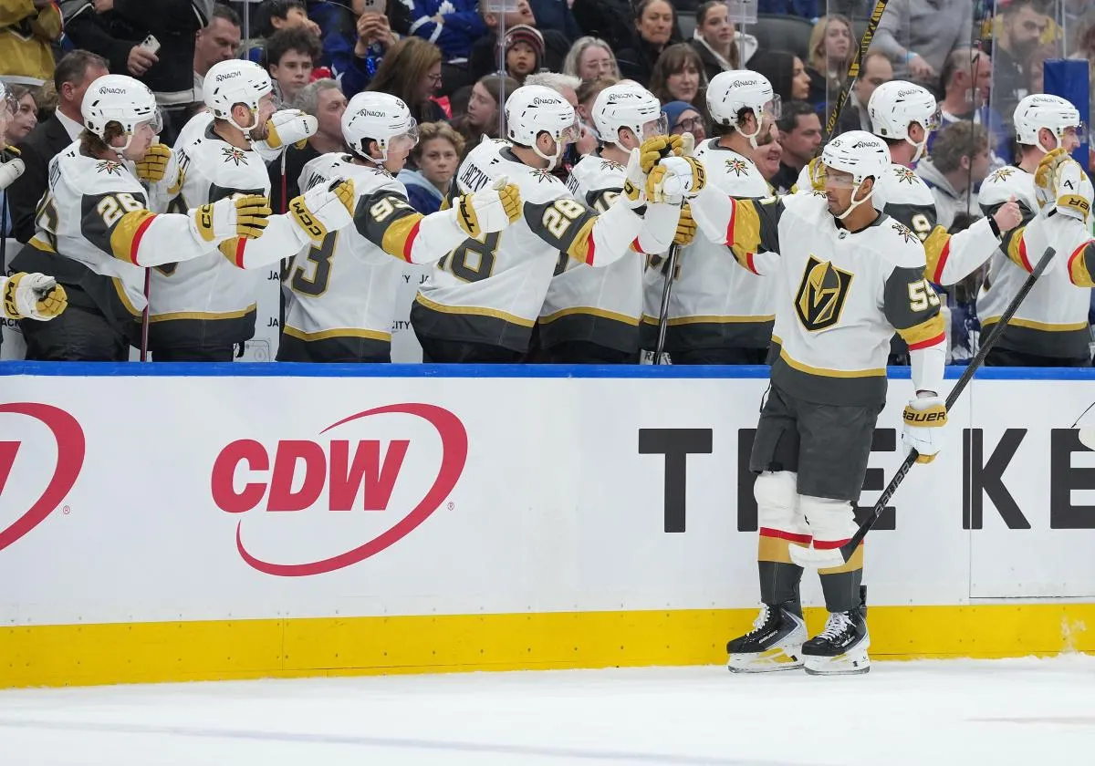 Vegas Golden Knights right wing Keegan Kolesar (55) celebrates at the bench after scoring goal against the Toronto Maple Leafs during the first period at Scotiabank Arena.