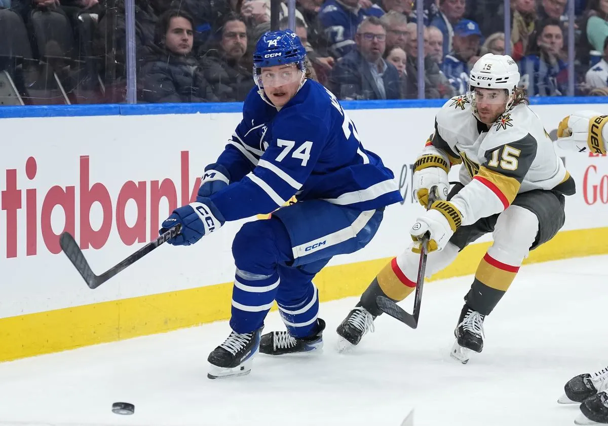 Toronto Maple Leafs center Bobby McMann (74) battles for the puck with Vegas Golden Knights defenseman Noah Hanifin (15) during the third period at Scotiabank Arena.