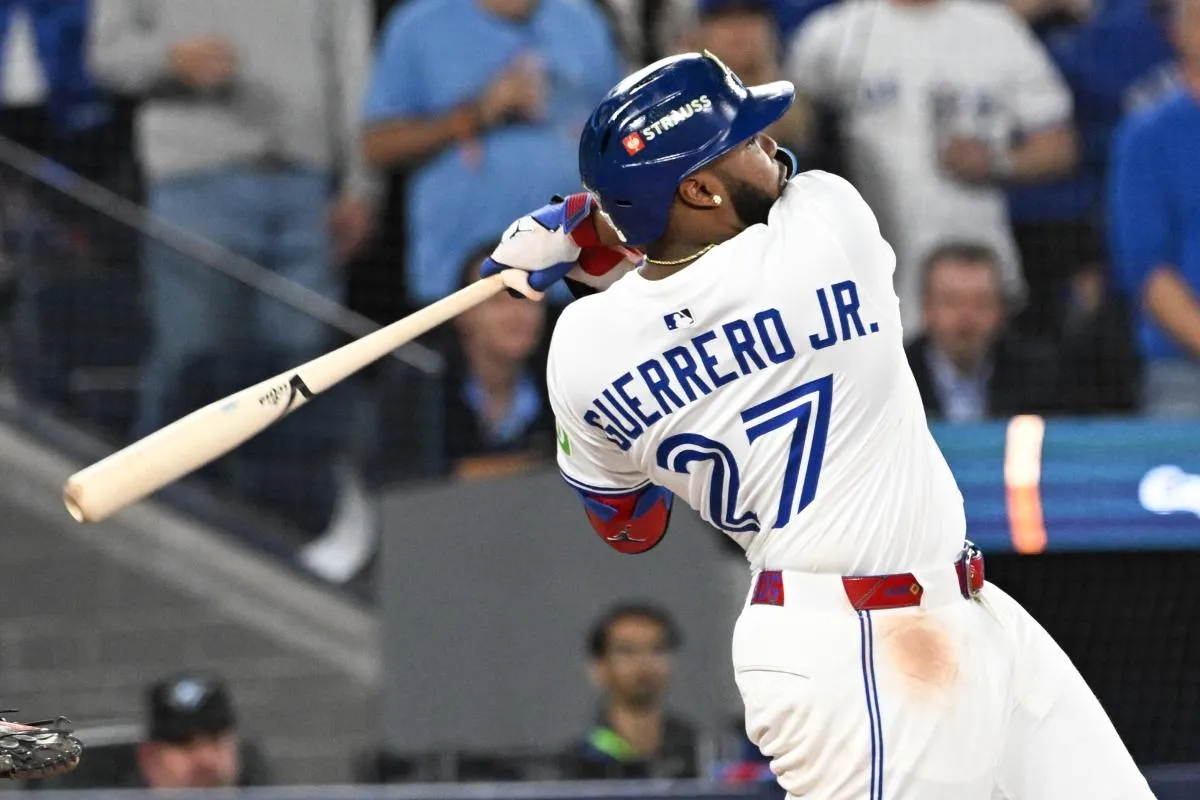 Toronto Blue Jays first baseman Vladimir Guerrero Jr. (27) hits a single against the Los Angeles Dodgers in the third inning during game two of the 2025 MLB World Series at Rogers Centre.