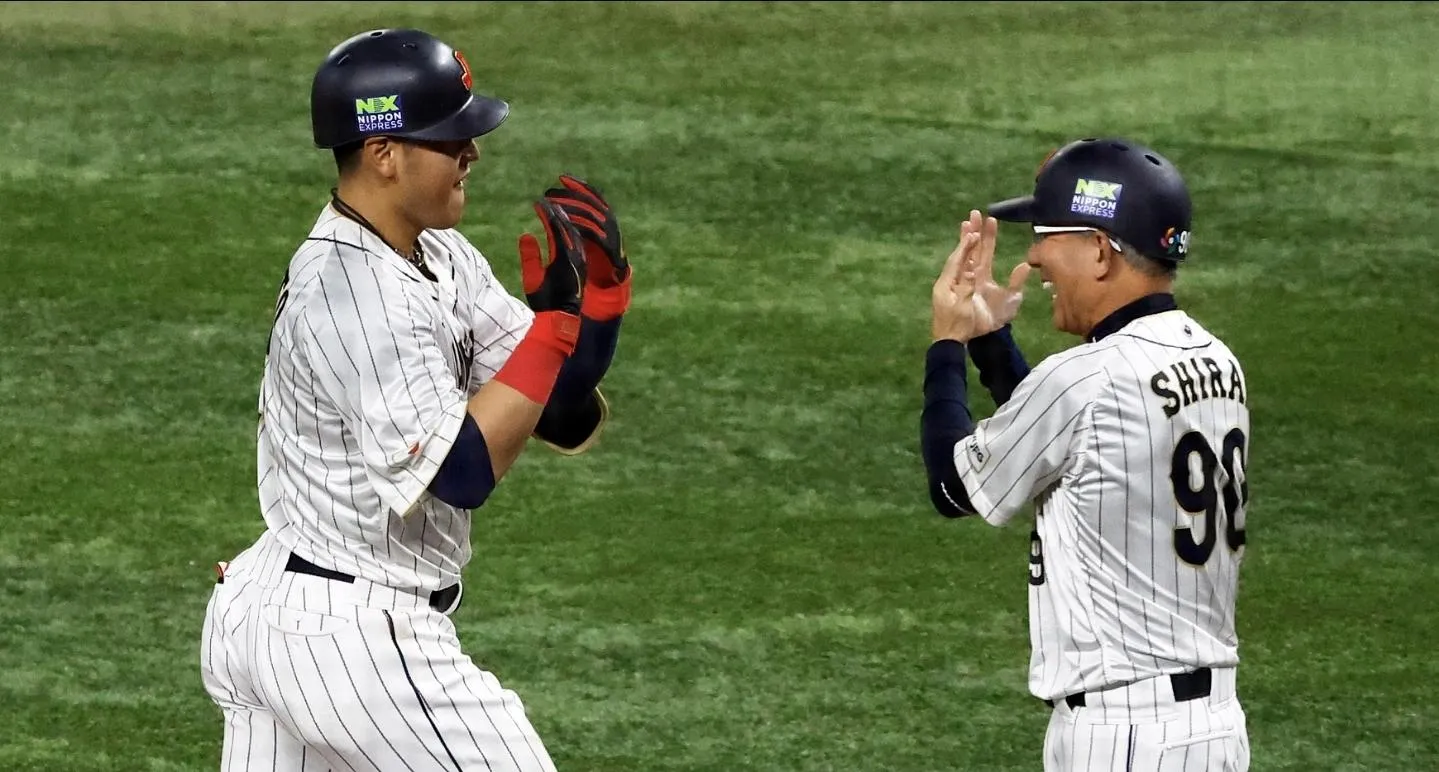 Japan first baseman Kazuma Okamoto (25) celebrates his home run against the USA in the fourth inning at LoanDepot Park.