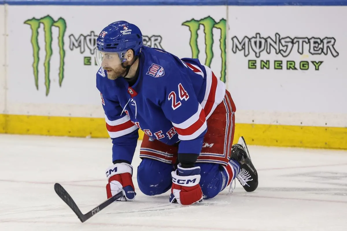 New York Rangers defenseman Carson Soucy (24) falls to the ice after getting injured in the second period against the Ottawa Senators at Madison Square Garden.