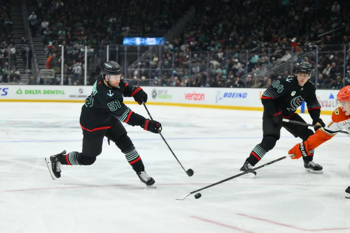 Seattle Kraken center Shane Wright (51) shoots the puck against the Anaheim Ducks during the second period at Climate Pledge Arena.