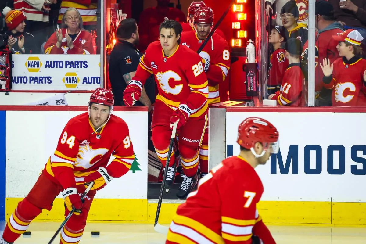 Calgary Flames defenseman Zach Whitecloud (28) takes the ice during the warmup period against the New Jersey Devils at Scotiabank Saddledome.