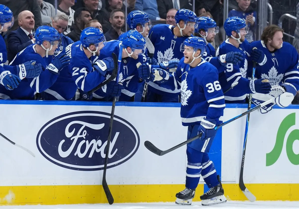 Toronto Maple Leafs defenseman Dakota Mermis (36) celebrates at the bench after scoring goal against the Columbus Blue Jackets during the second period at Scotiabank Arena.
