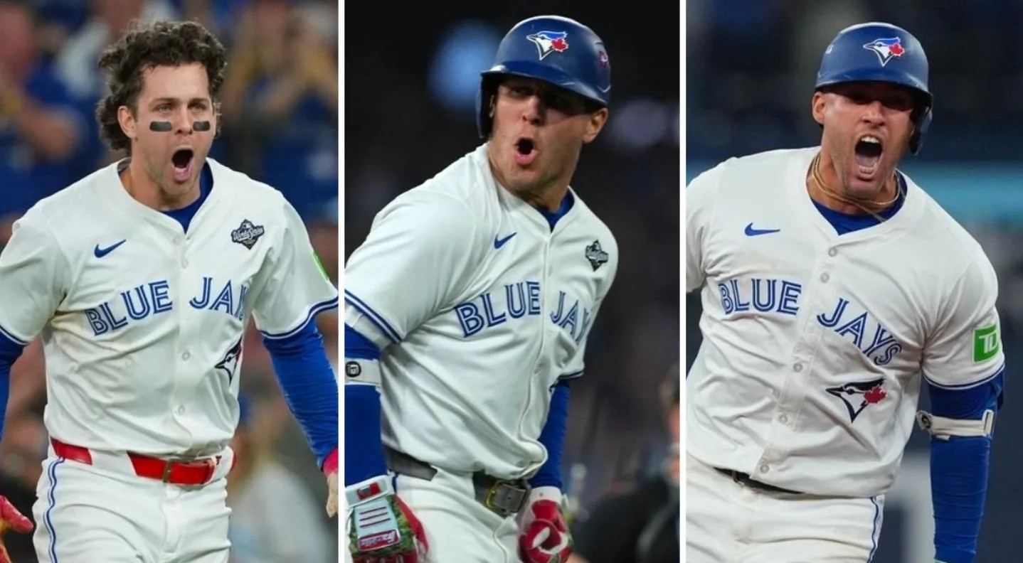Toronto Blue Jays third baseman Ernie Clement (22), right fielder George Springer (4), and Centerfielder Daulton Varsho (5) against the Los Angeles Dodgers in the 2025 MLB World Series at Rogers Centre.