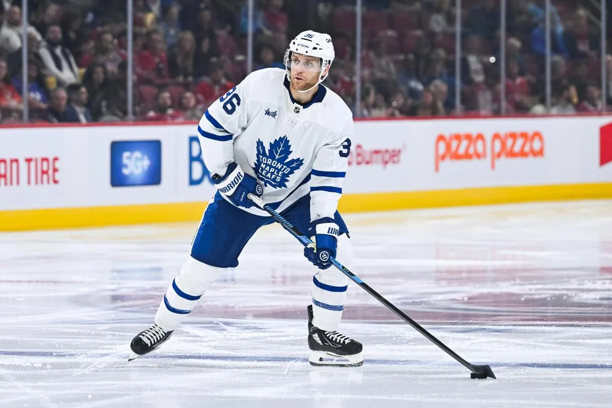 Toronto Maple Leafs defenseman Dakota Mermis (36) plays the puck against the Montreal Canadiens during the second period at Bell Centre.