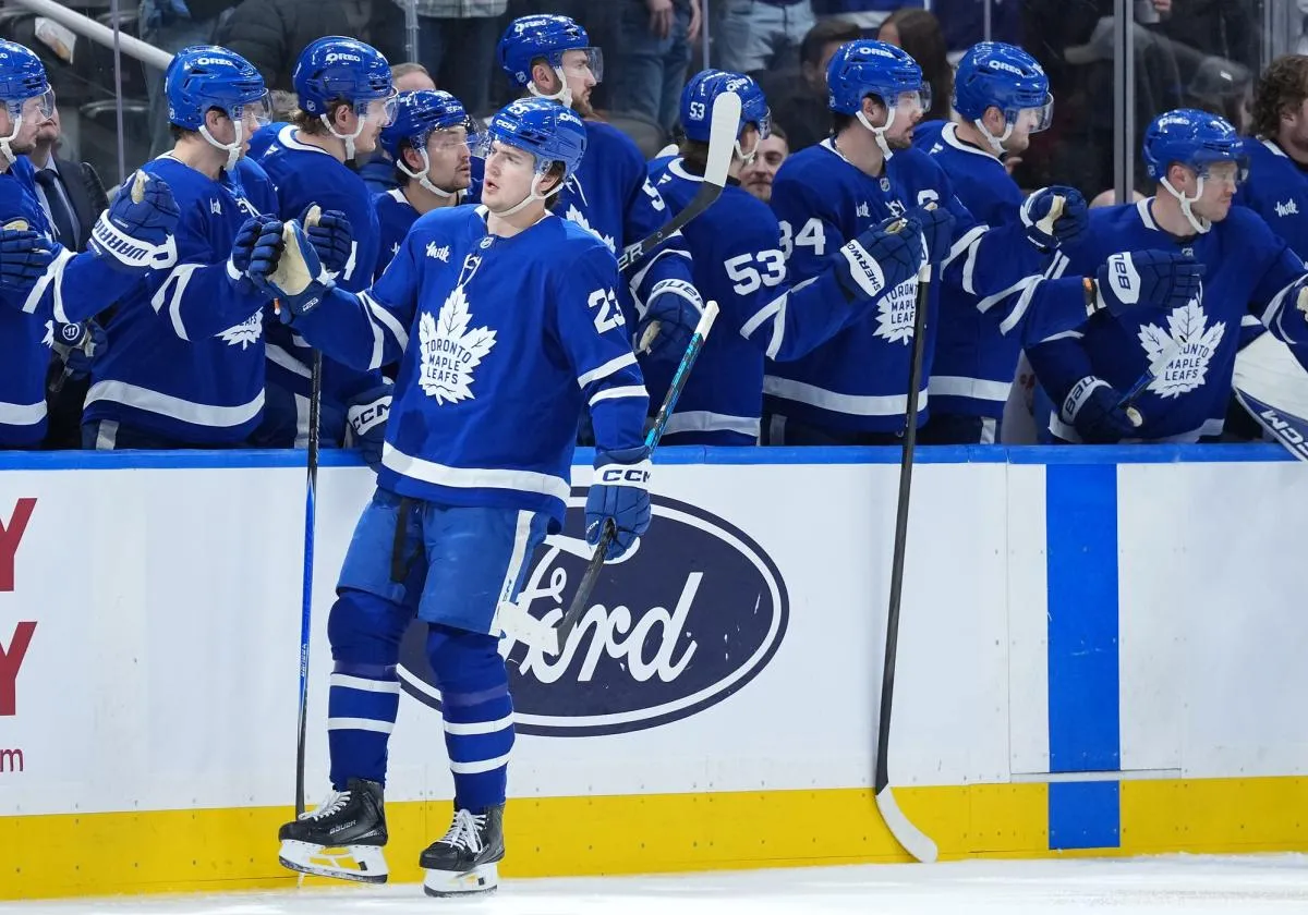 Toronto Maple Leafs left wing Matthew Knies (23) celebrates at the bench after scoring a goal against the Florida Panthers during the second period at Scotiabank Arena.