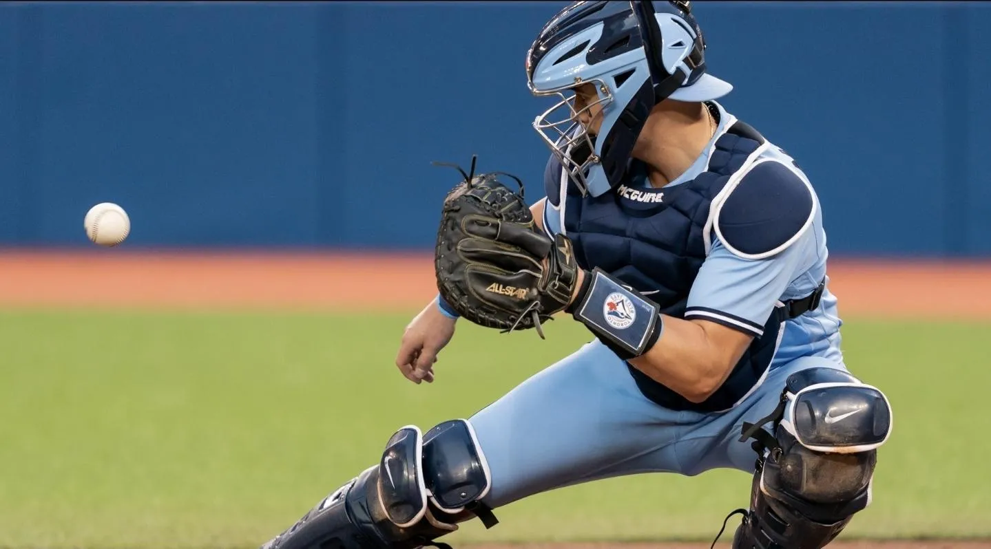 Toronto Blue Jays catcher Reese McGuire (7) looks at the ball against the Cleveland Indians at Rogers Centre.