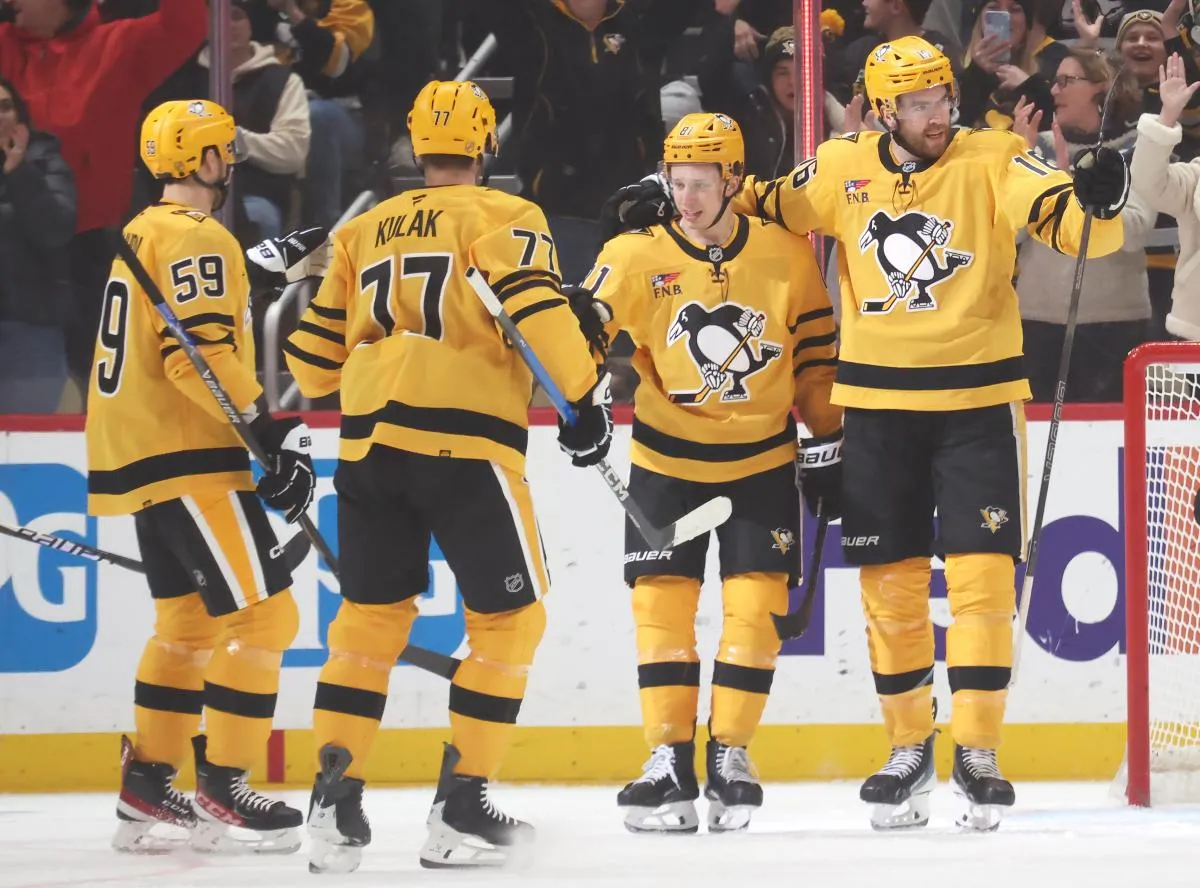 Pittsburgh Penguins right wing Egor Chinakhov (59) and defenseman Brett Kulak (77) and center Ben Kindel (81) congratulate right wing Justin Brazeau (16) on his power play goal against the Philadelphia Flyers during the first period at PPG Paints Arena.