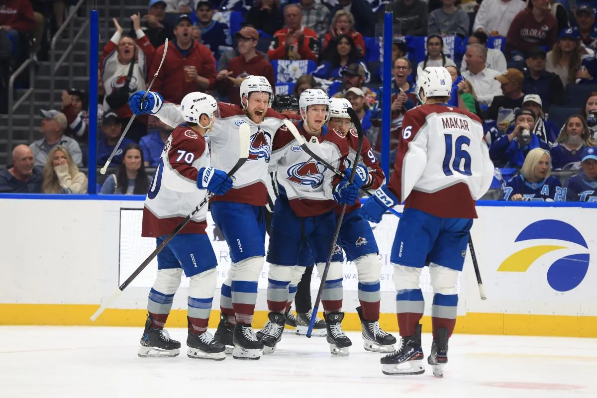 Colorado Avalanche center Parker Kelly (17) is congratulated by defenseman Sam Malinski (70) , center Zakhar Bardakov (93) and defenseman Ilya Solovyov (28) after he scored a goal against the Tampa Bay Lightning during the second period at Benchmark International Arena.