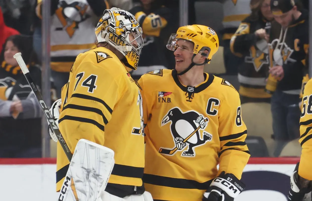 Pittsburgh Penguins goaltender Stuart Skinner (74) and center Sidney Crosby (87) react after defeating the Philadelphia Flyers at PPG Paints Arena.