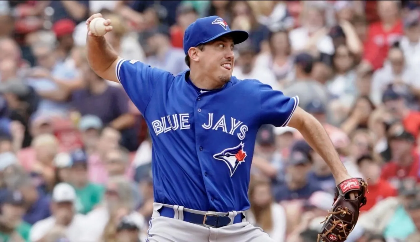 Toronto Blue Jays relief pitcher Derek Law (64) throws a pitch against the Boston Red Sox in the eighth inning at Fenway Park.