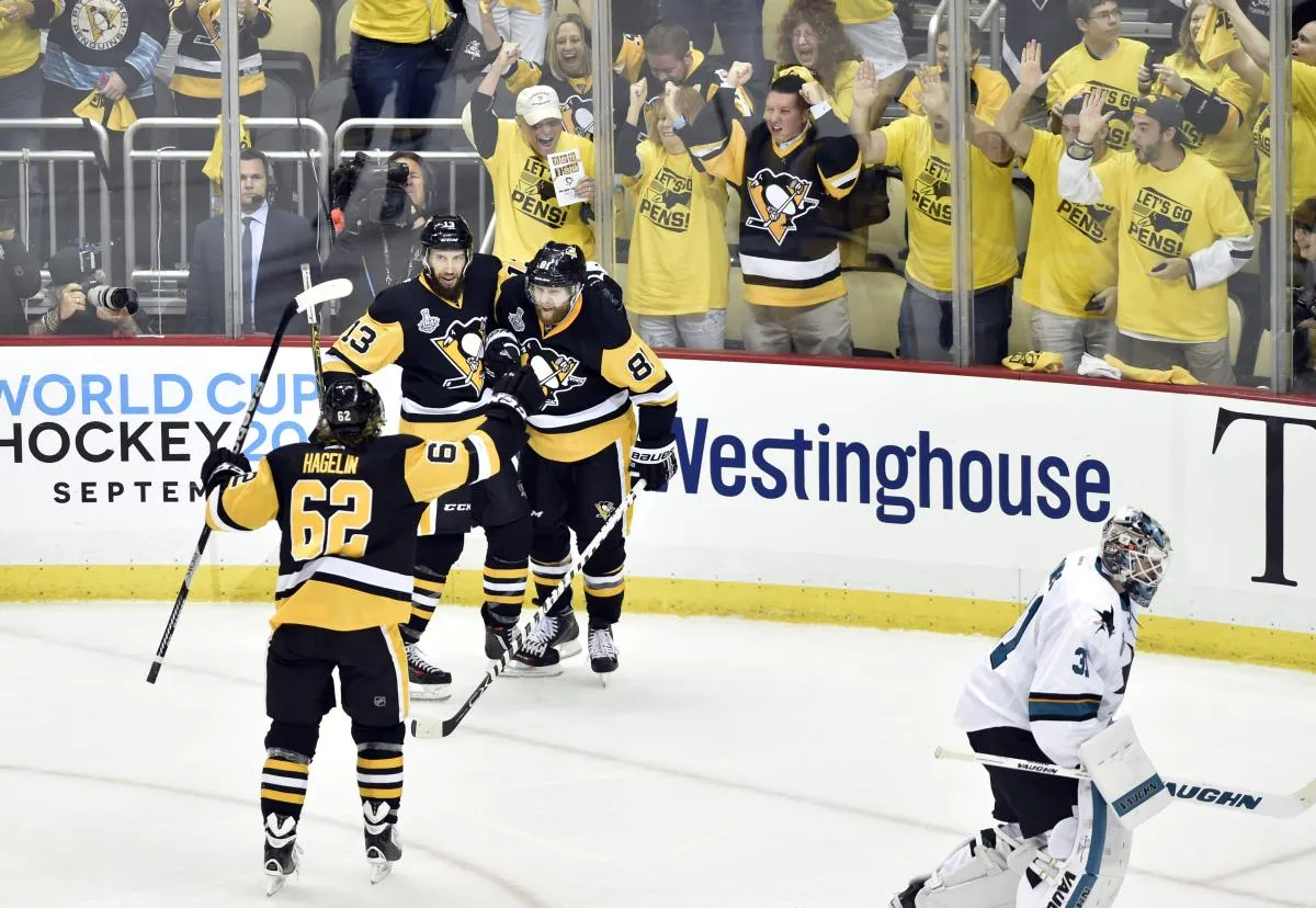 Pittsburgh Penguins right wing Phil Kessel (81) celebrates with center Nick Bonino (13) and left wing Carl Hagelin (62) after scoring a goal against the San Jose Sharks in the second period in game two of the 2016 Stanley Cup Final at Consol Energy Center.