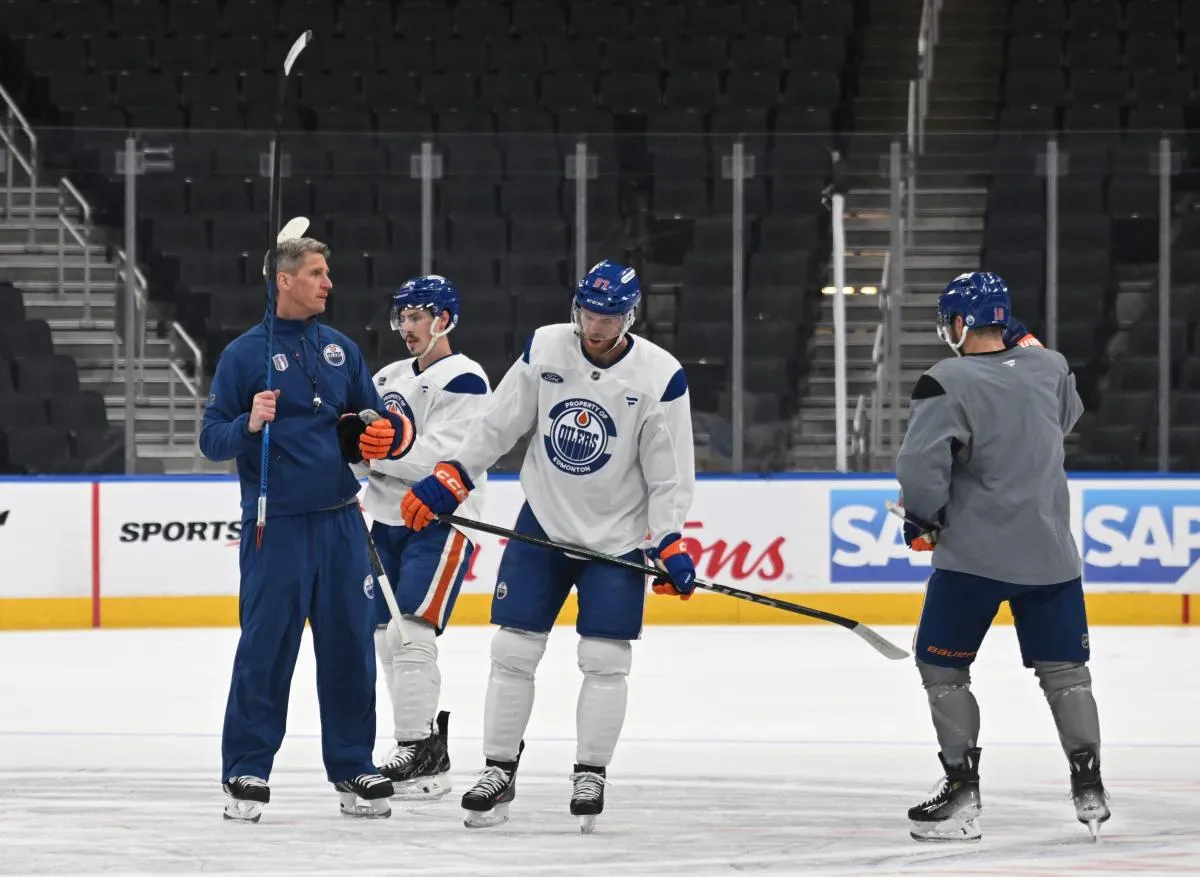 Edmonton Oilers head coach Kris Knoblauch with Oilers centre Connor McDavid (97) are seen out on the ice at the team practice during media day in advance of the 2025 Stanley Cup Final at Rogers Place.