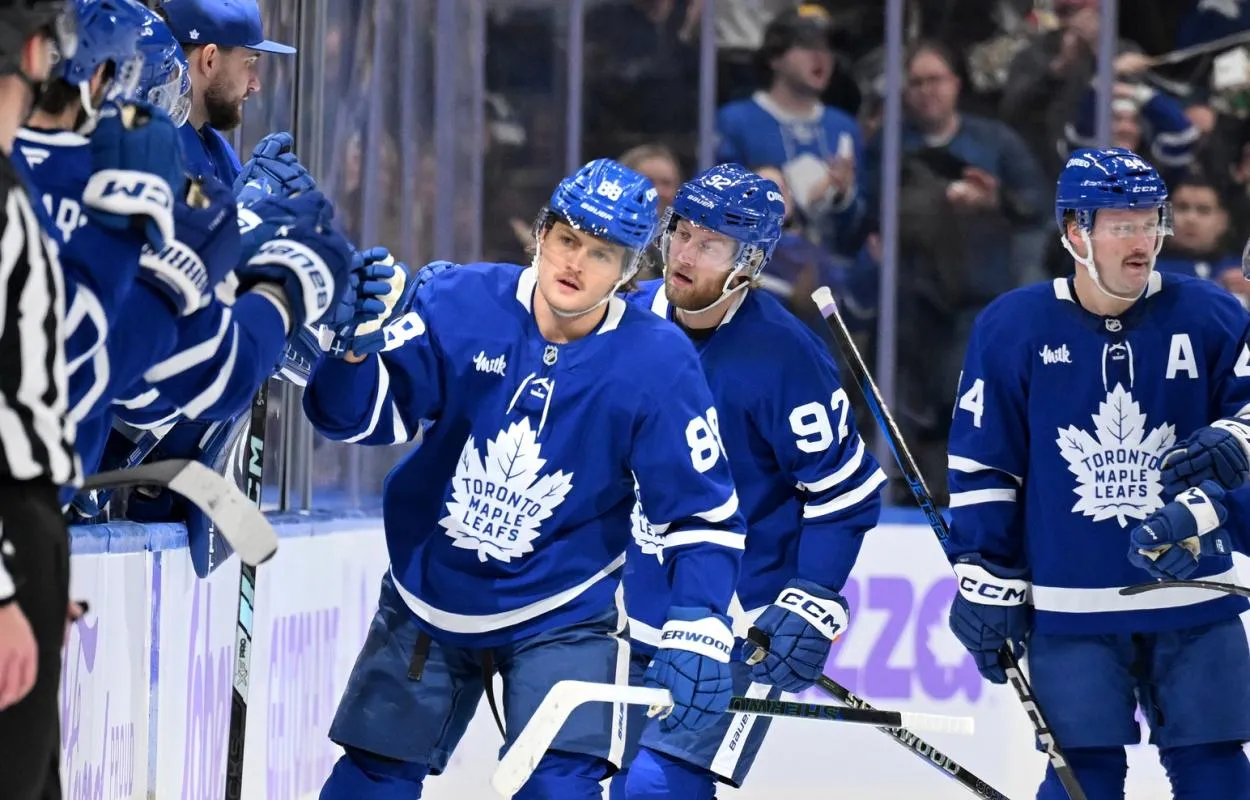 Toronto Maple Leafs forward William Nylander (88) celebrates with teammates at the bench after scoring against the Utah Hockey Club in the second period at Scotiabank Arena.