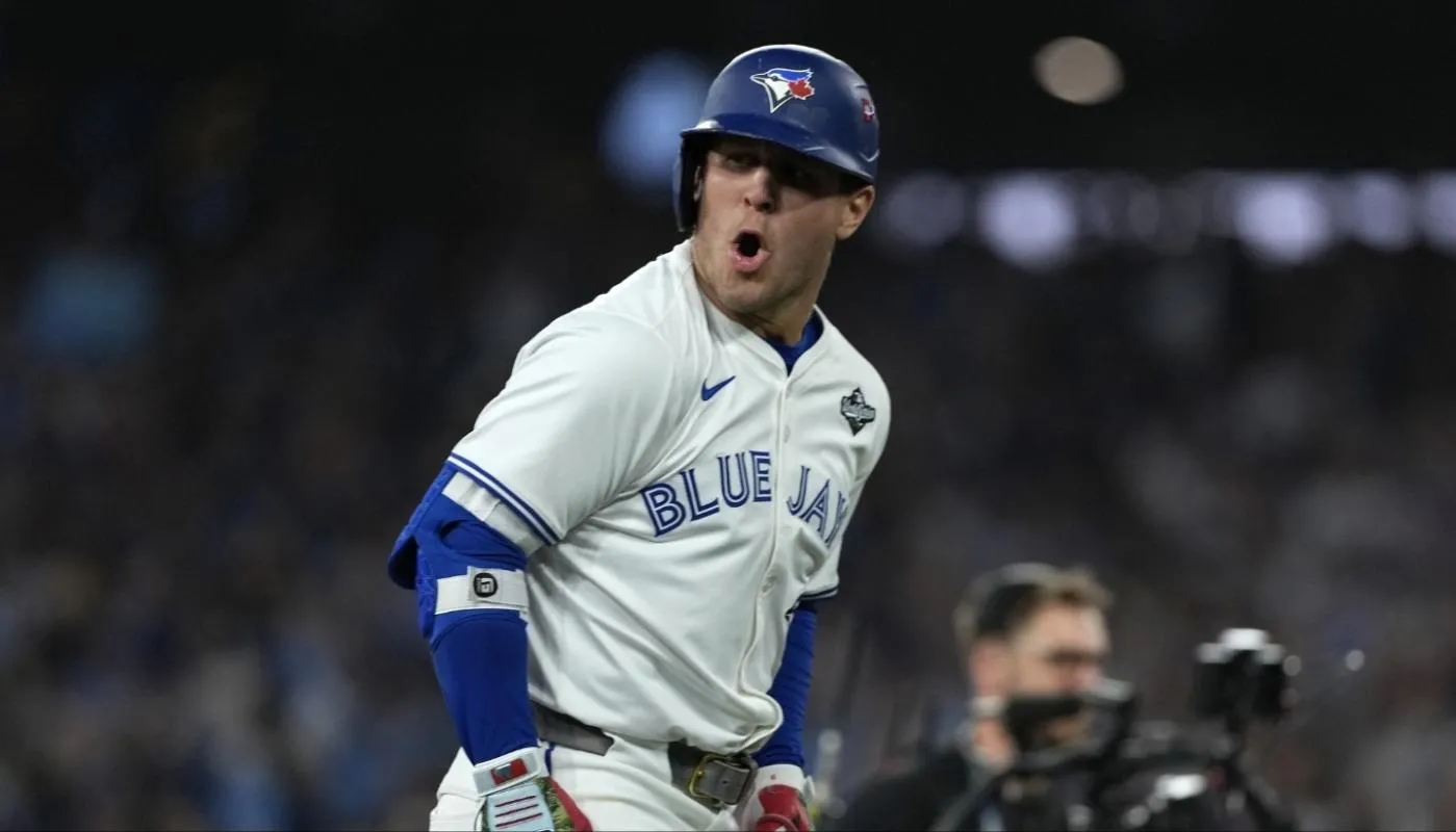 Toronto Blue Jays center fielder Daulton Varsho (5) celebrates after hitting a two run home run against the Los Angeles Dodgers in the fourth inning during game one of the 2025 MLB World Series at Rogers Centre.
