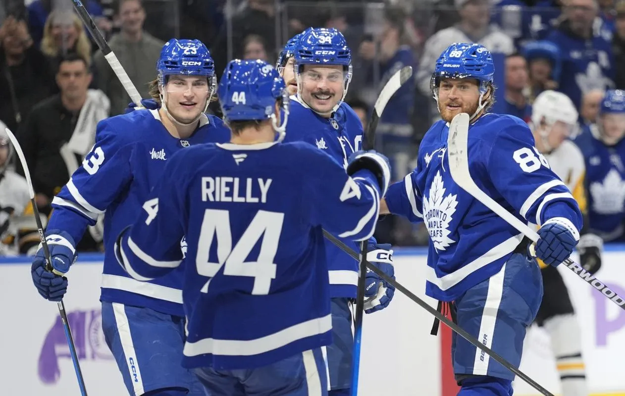 Toronto Maple Leafs defenseman Morgan Rielly (44), forward Matthew Knies (23) and forward Auston Matthews (34) congratulate forward William Nylander (88) after his second goal of the third period against the Pittsburgh Penguins at Scotiabank Arena.