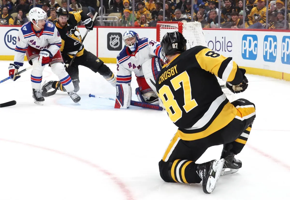 Pittsburgh Penguins center Sidney Crosby (87) shoots against New York Rangers goaltender Jonathan Quick (32) during the third period at PPG Paints Arena.