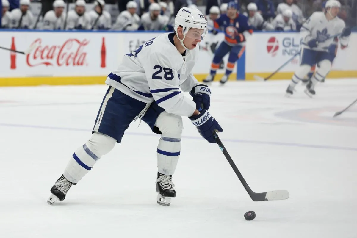 Toronto Maple Leafs defenseman Troy Stecher (28) moves the puck against the New York Islanders during the second period at UBS Arena.