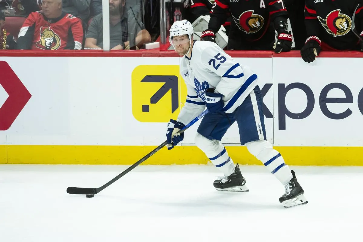 Toronto Maple Leafs defenseman Brandon Carlo (25) controls the puck in game four of the first round of the 2025 Stanley Cup Playoffs against the Ottawa Senators at the Canadian Tire Centre.