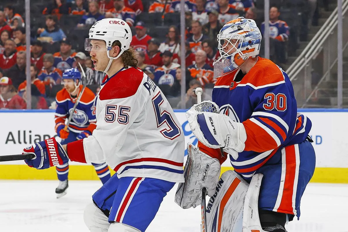 L'attaquant des Canadiens de Montr&eacute;al, Michael Pezzetta (55), tente de masquer la vue du gardien des Oilers d'Edmonton, Calvin Pickard (30), durant la deuxi&egrave;me p&eacute;riode au Rogers Place.