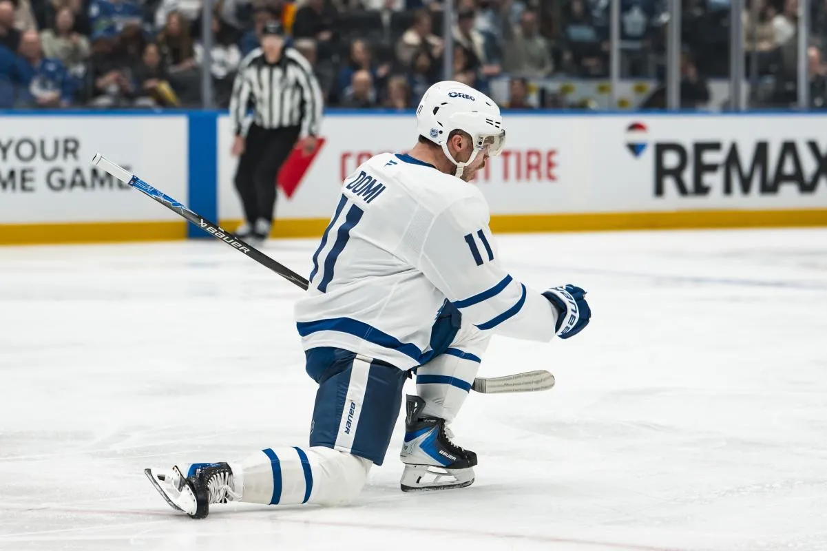Toronto Maple Leafs forward Max Domi (11) celebrates his goal against the Vancouver Canucks in the third period at Rogers Arena.