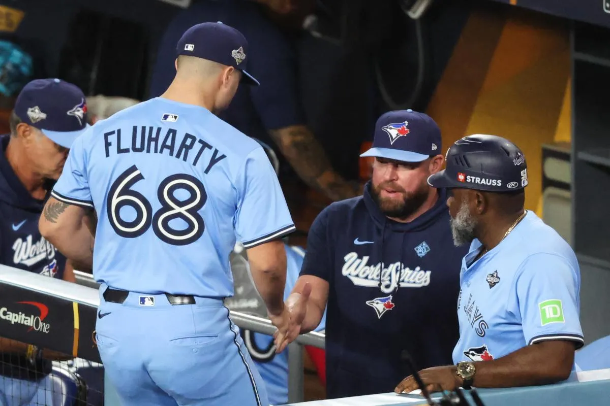 Toronto Blue Jays pitcher Mason Fluharty (68) walks into the dugout after entering the game to pitch during the sixth inning against the Los Angeles Dodgers during game four of the 2025 MLB World Series at Dodger Stadium.