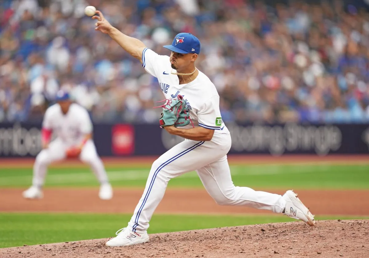 Toronto Blue Jays relief pitcher Jordan Hicks (12) pitches against the Kansas City Royals during the ninth inning at Rogers Centre.