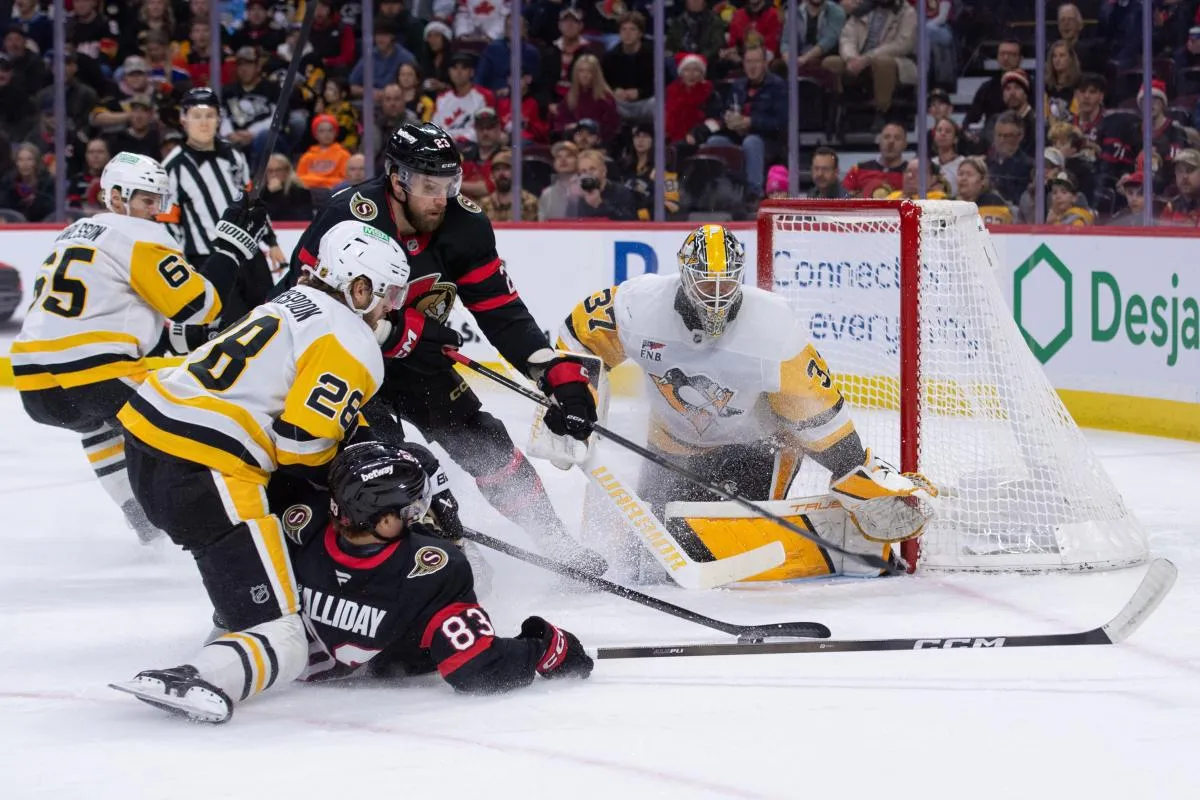 Pittsburgh Penguins defenseman Parker Wotherspoon (28) takes down Ottawa Senators center Stephen Halliday (83) in the first period at the Canadian Tire Centre.