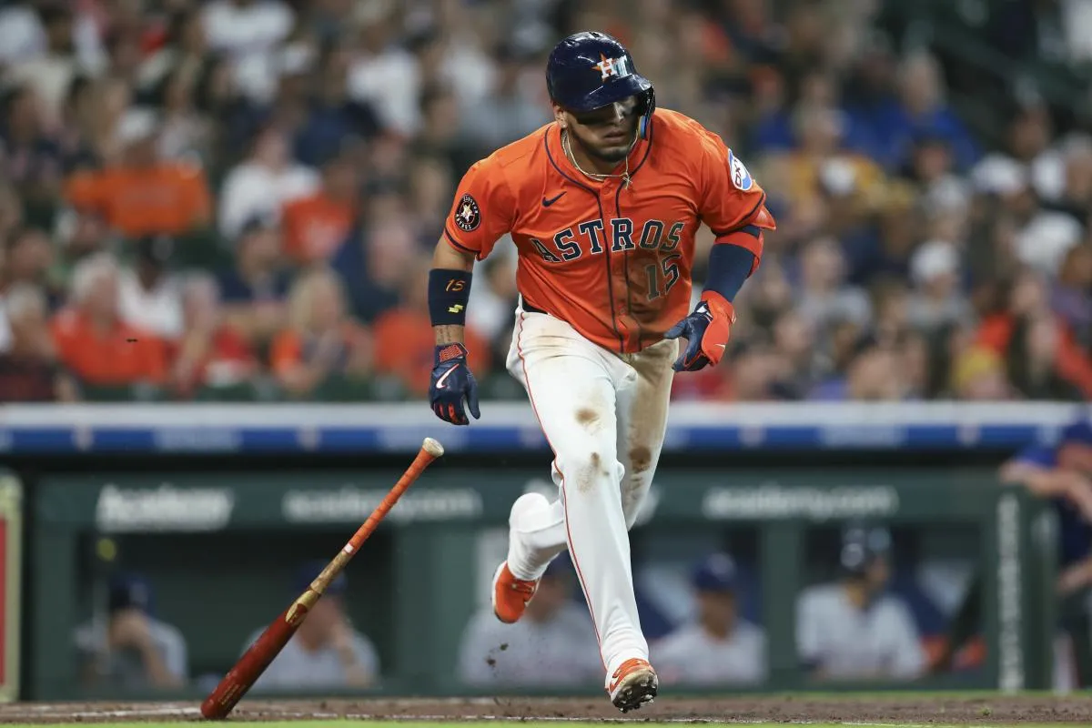 Houston Astros third baseman Isaac Paredes (15) hits a single during the first inning against the Texas Rangers at Daikin Park.