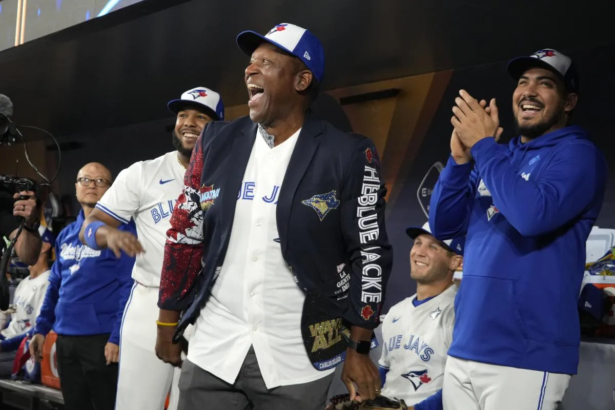 Toronto Blue Jays former player Joe Carter wears the home run jacket in the dugout before game two of the 2025 MLB World Series against the Los Angeles Dodgers at Rogers Centre.