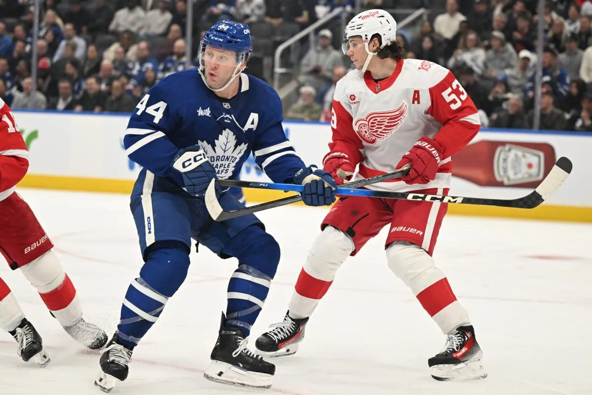 Toronto Maple Leafs defenseman Morgan Rielly (44) is covered by Detroit Red Wings defenseman Moritz Seider (53) in the third period at Scotiabank Arena.