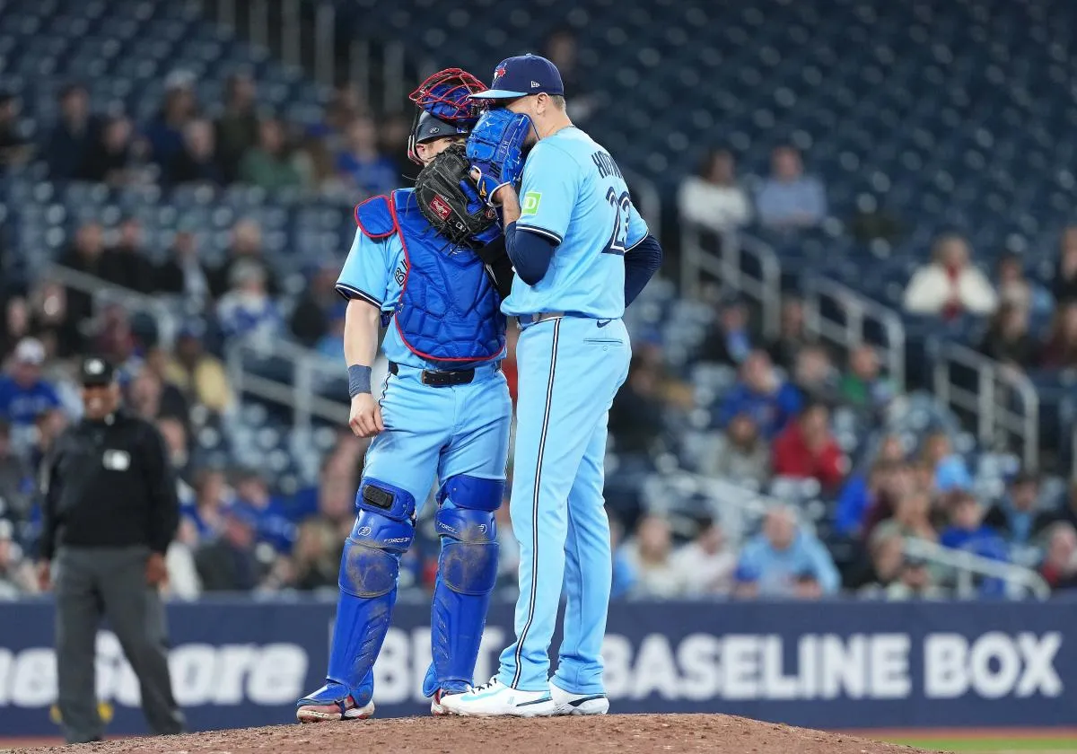 Toronto Blue Jays catcher Tyler Heineman (55) talks with relief pitcher Jeff Hoffman (23) against the Washington Nationals during the ninth inning at Rogers Centre
