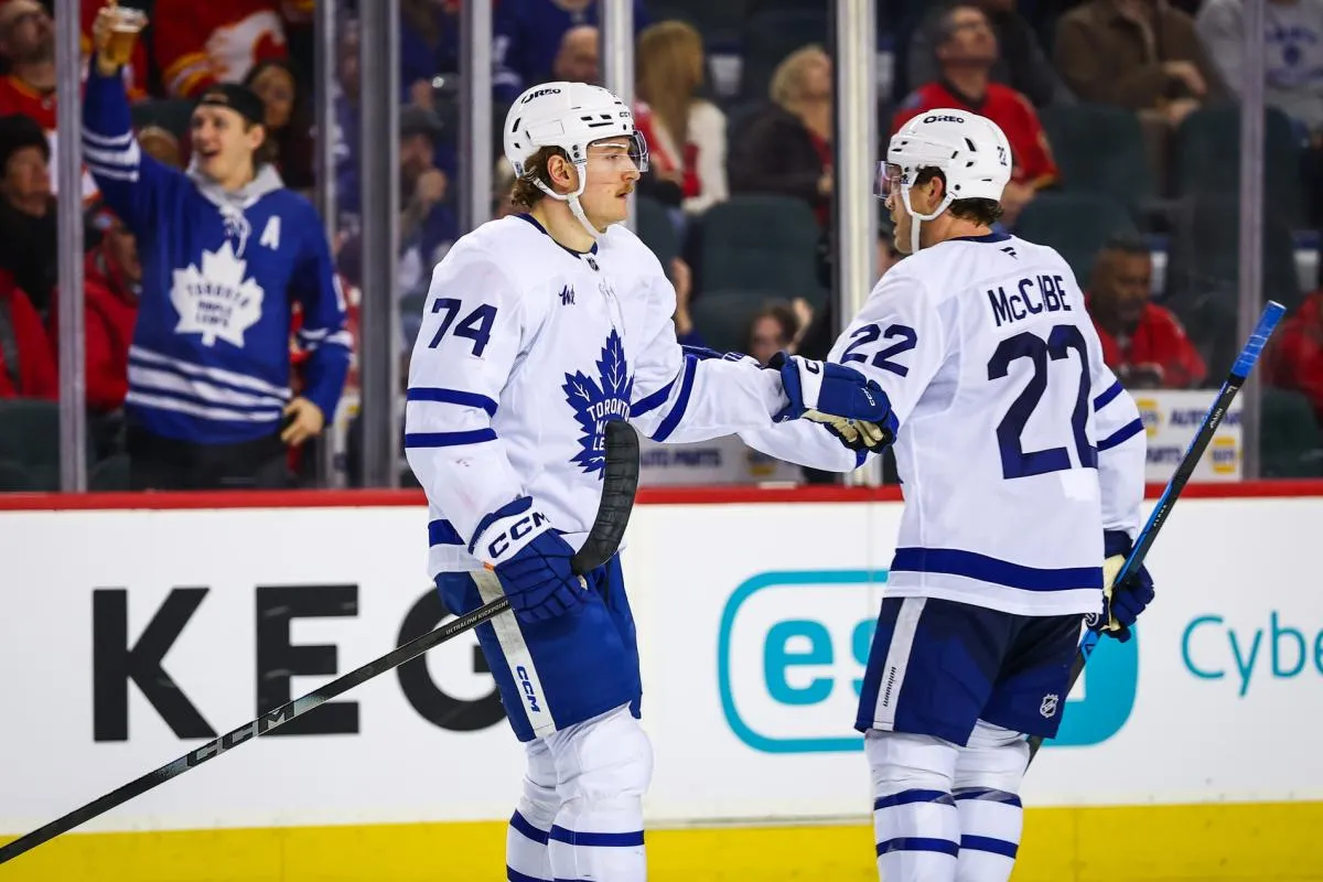 Toronto Maple Leafs center Bobby McMann (74) celebrates his goal with teammates against the Calgary Flames during the third period at Scotiabank Saddledome