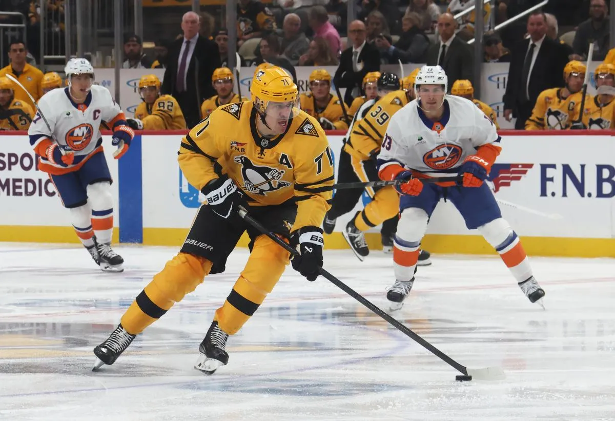 Pittsburgh Penguins center Evgeni Malkin (71) skates with the puck against the New York Islanders during the third period at PPG Paints Arena.