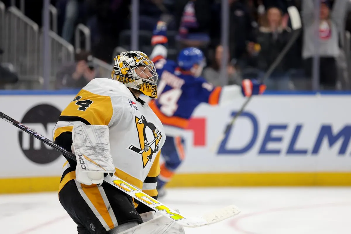 Pittsburgh Penguins goaltender Stuart Skinner (74) reacts after giving up the game winning overtime goal to New York Islanders center Bo Horvat (14) at UBS Arena.