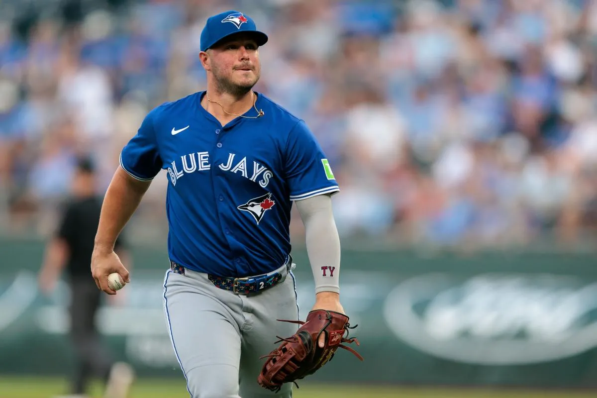 Toronto Blue Jays first base Ty France (2) heads to the dugout after the first inning against the Kansas City Royals at Kauffman Stadium.