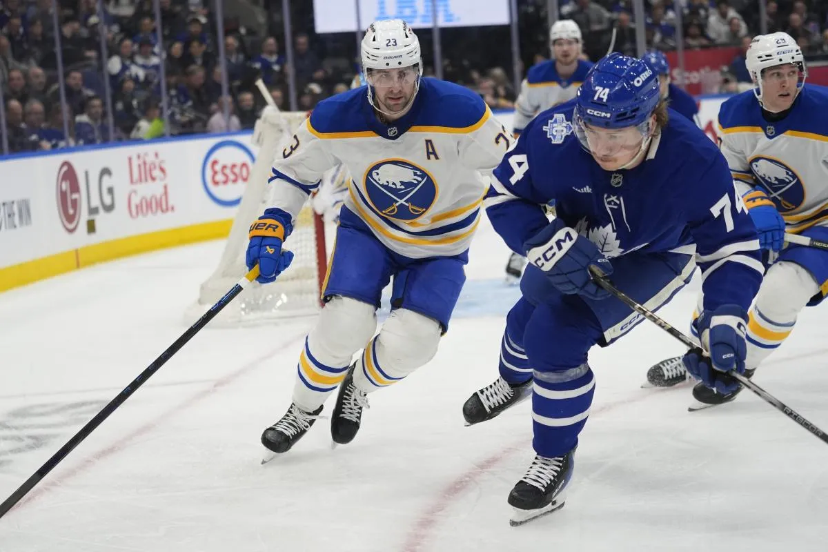 Buffalo Sabres defenseman Mattias Samuelsson (23) defends against Toronto Maple Leafs forward Bobby McMann (74) during the third period at Scotiabank Arena
