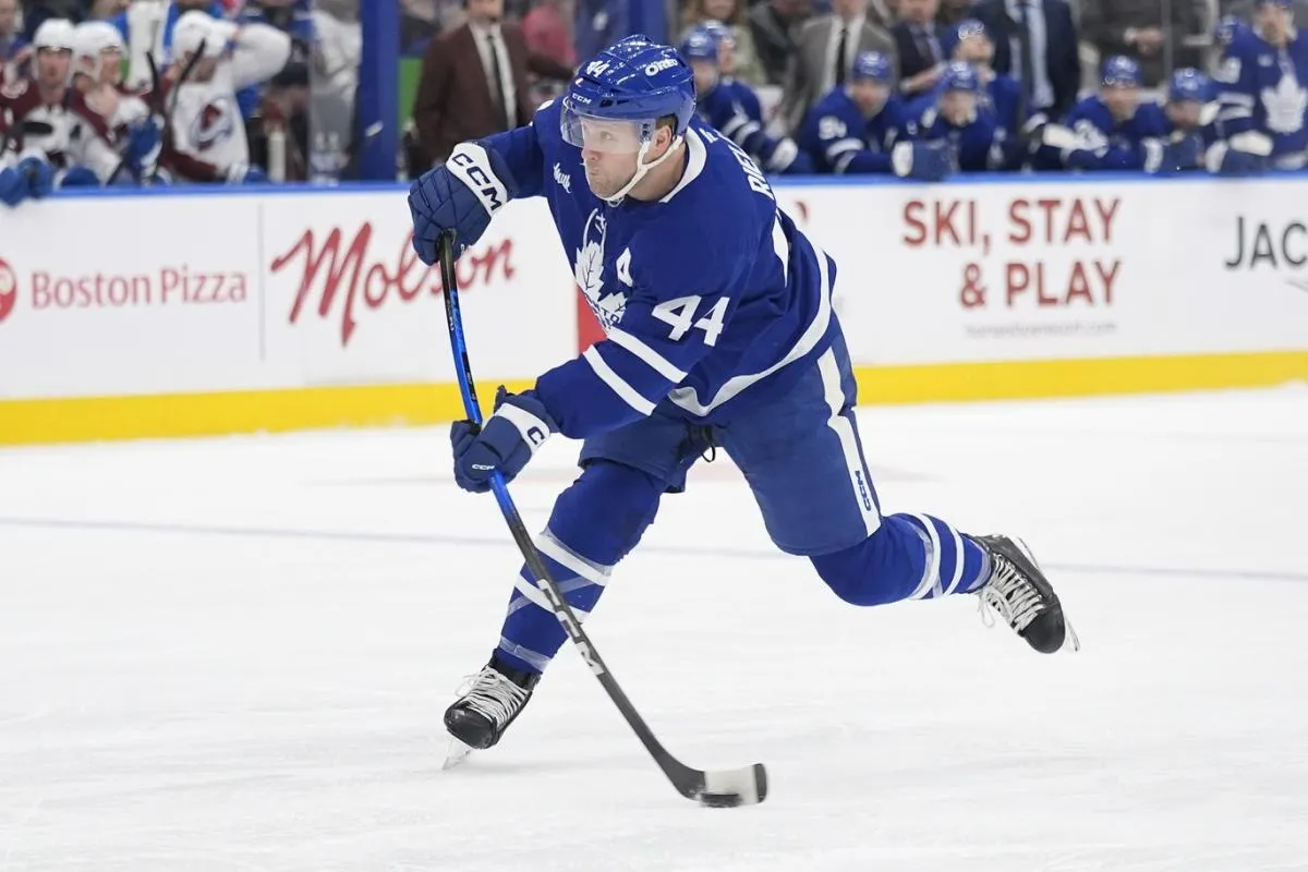 Toronto Maple Leafs defenseman Morgan Rielly (44) shoots th epuck against the Colorado Avalanche during the first period at Scotiabank Arena.