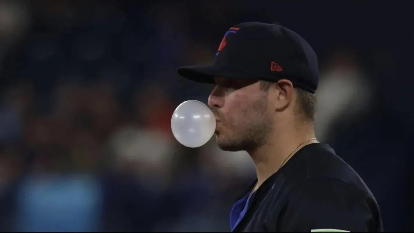 Toronto Blue Jays first baseman Ty France blows a bubble in their MLB game against the Kansas City Royals at Rogers Centre.