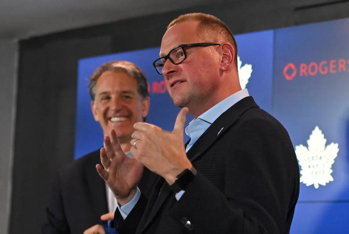 Toronto Maple Leafs new general manager Brad Treliving is introduced by club president Brendan Shanahan (left) at a press conference at Scotiabank Arena