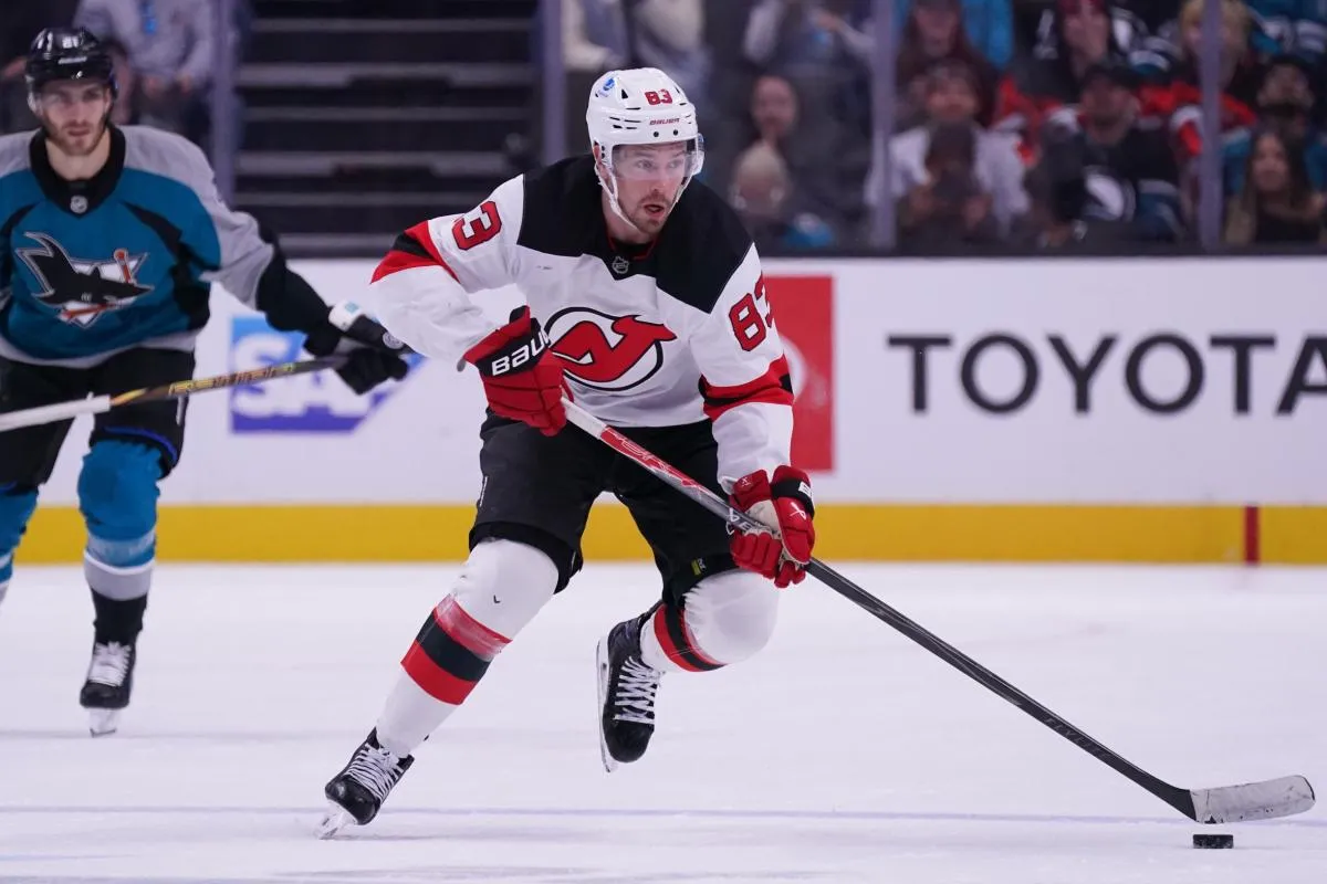 New Jersey Devils center Juho Lammikko (83) controls the puck against the San Jose Sharks in the second period at SAP Center at San Jose.