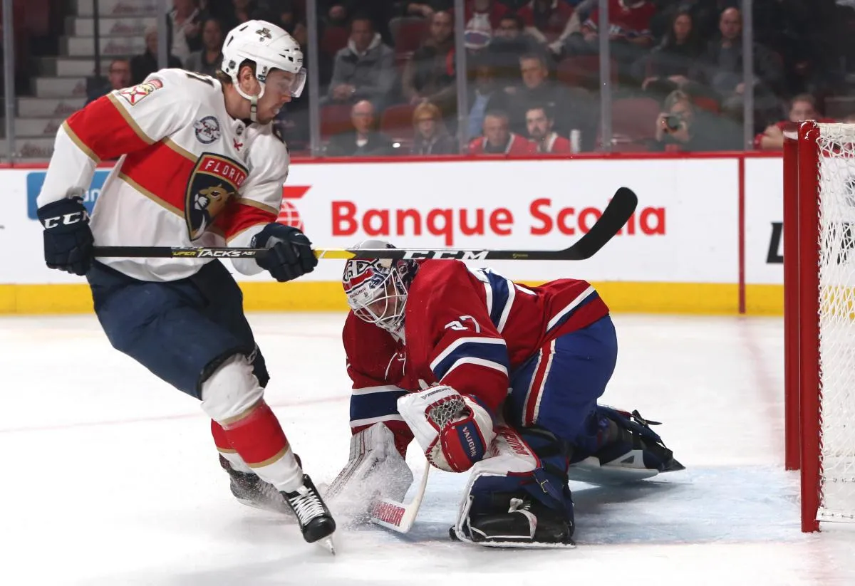 Juho Lammikko (91), ailier droit des Panthers de la Floride, tire au but sur Antti Niemi (37), gardien des Canadiens de Montr&eacute;al, durant la premi&egrave;re p&eacute;riode au Centre Bell.