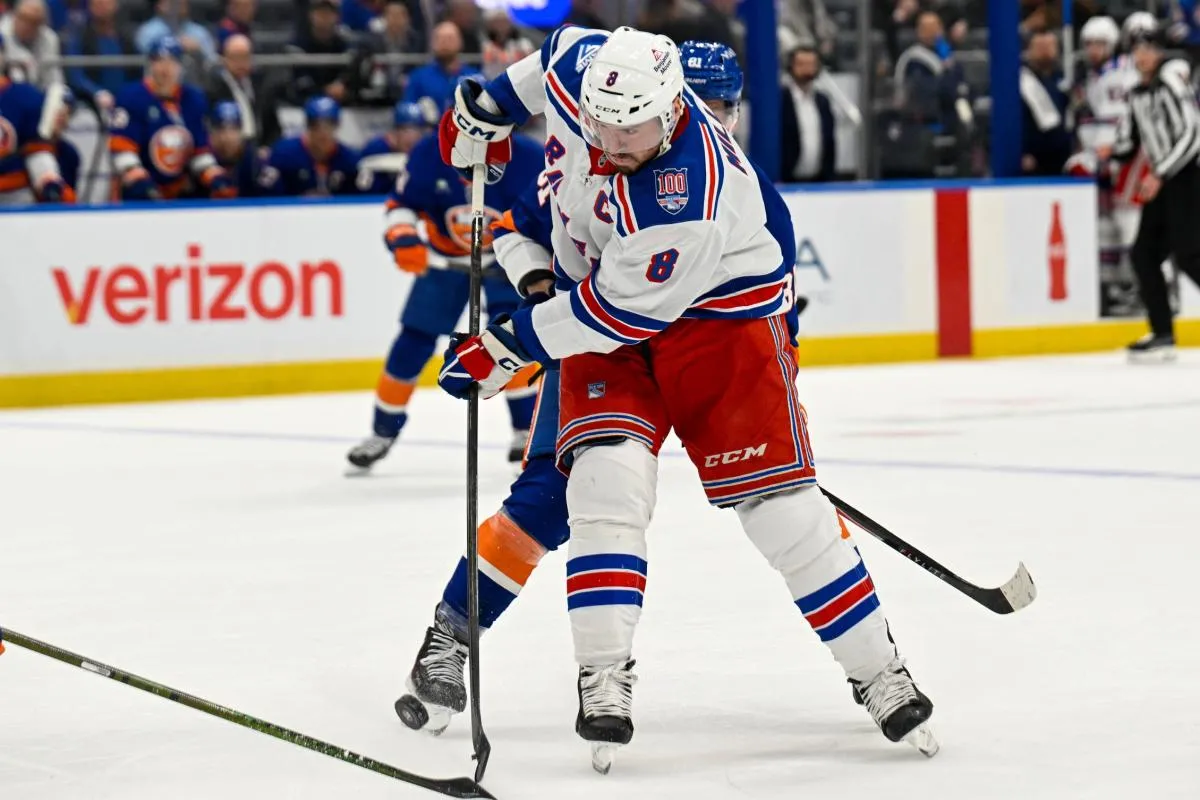 New York Rangers center J.T. Miller (8) attempts a shot against the New York Islanders during the first period at UBS Arena.
