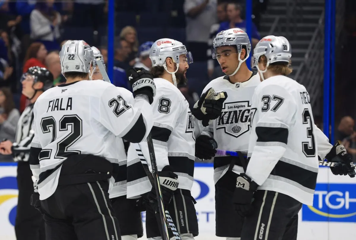 Los Angeles Kings defenseman Drew Doughty (8) and right wing Quinton Byfield (55) and left wing Warren Foegele (37) and left wing Kevin Fiala (22) talk during the first period against the Tampa Bay Lightning at Benchmark International Arena.
