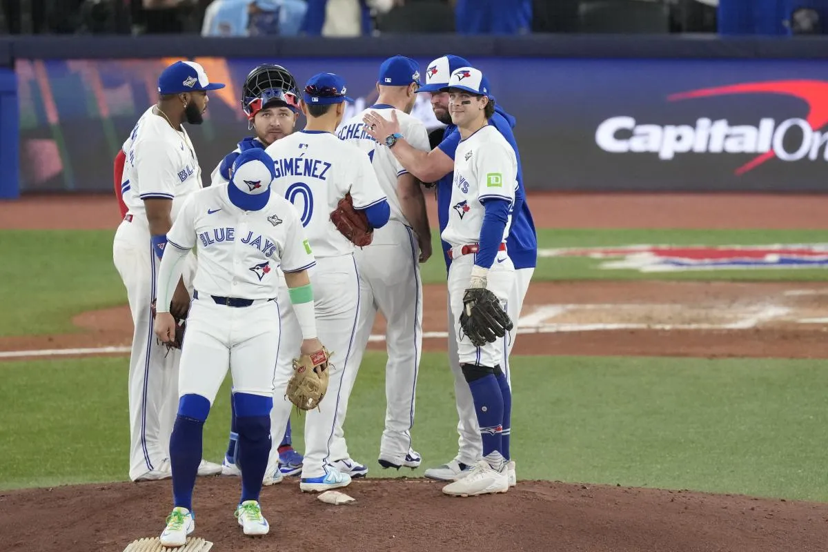 Toronto Blue Jays manager John Schneider (14) relieves pitcher Max Scherzer (31) in the fifth inning during game seven of the 2025 MLB World Series at Rogers Centre.